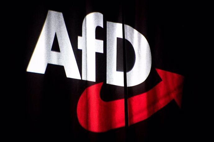 Archivo - FILED - 30 November 2019, Lower Saxony, Braunschweig: The logo of the Alternative for Germany (AfD) party is projected onto a curtain at the federal party conference. Germany's domestic intelligence agency has classified the entire AfD as a ri