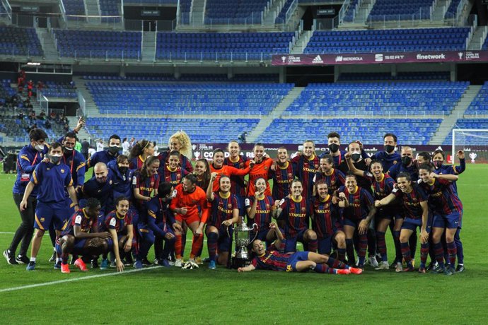 Players of FC Barcelona celebrate the victory with the trophy of Champions of the tournament the final round of the spanish women cup, Copa de la Reina, football match played between FC Barcelona and EDF Logrono at La Rosaleda stadium on February 13, 20