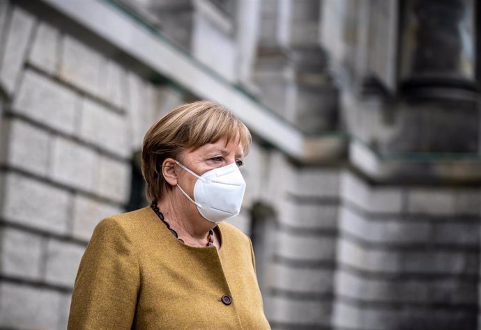 04 March 2021, Berlin: German Chancellor Angela Merkel leaves the Reichstag building after attending a plenary session in the German Bundestag. In its session, the parliament deals with the enacted regulations to contain the Coronavirus pandemic. Photo: