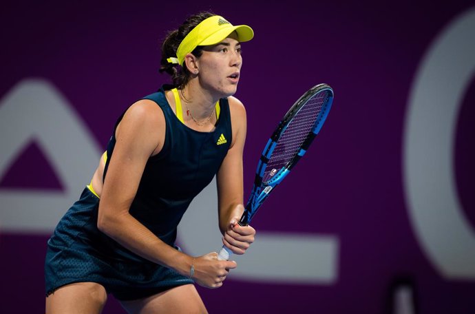 Garbine Muguruza of Spain in action during her second-round match at the 2021 Qatar Total Open WTA 500 tournament against Aryna Sabalenka of Belarus