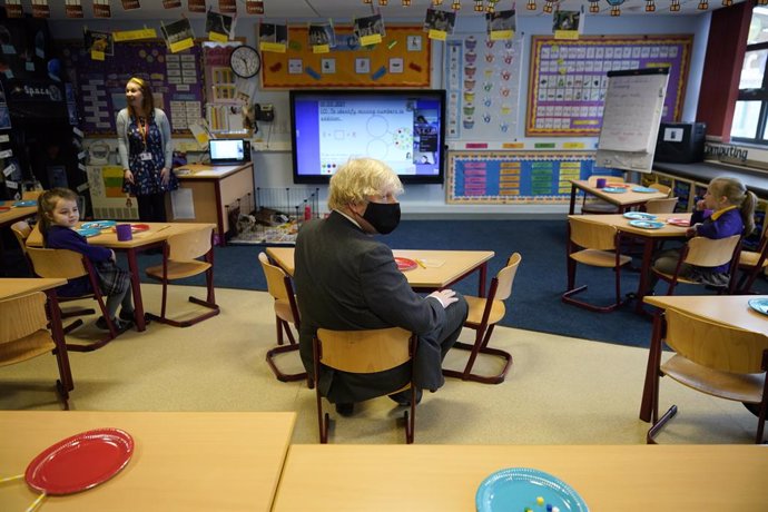 01 March 2021, United Kingdom, Stoke-on-Trent: UK Prime Minister Boris Johnson (C) takes part in a Year 2 maths lesson during a visit to St Mary's CE Primary School to see how they are preparing for students to return. Photo: Christopher Furlong/PA Wire