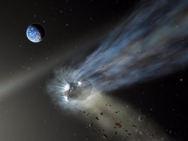 Ilustración de un cometa de la Nube de Oort a su paso por el sistema solar interior con polvo y gas que se evaporan en su cola.