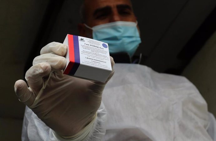 17 February 2021, Palestinian Territories, Rafah: A Palestinian health worker holds a pack of the Sputnik V COVID-19 vaccine. The Gaza Strip received its first batch of the Sputnik V COVID-19 vaccine on Wednesday.