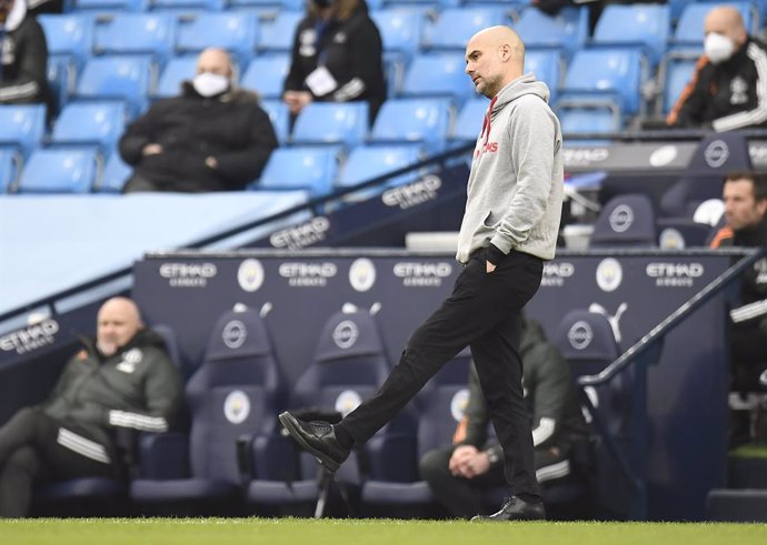 07 March 2021, United Kingdom, Manchester: Manchester City manager Pep Guardiola appears frustrated during the English Premier League soccer match between Manchester City and Manchester United at the Etihad Stadium. Photo: Peter Powell/PA Wire/dpa
