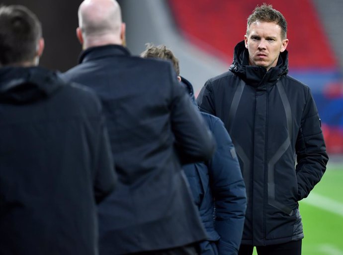 10 March 2021, Hungary, Budapest: Leipzig coach Julian Nagelsmann (R) is pictured after the UEFA Champions League round of 16, second leg soccer match between RB Leipzig and Liverpool FC at Puskas Arena. Photo: Marton Monus/dpa