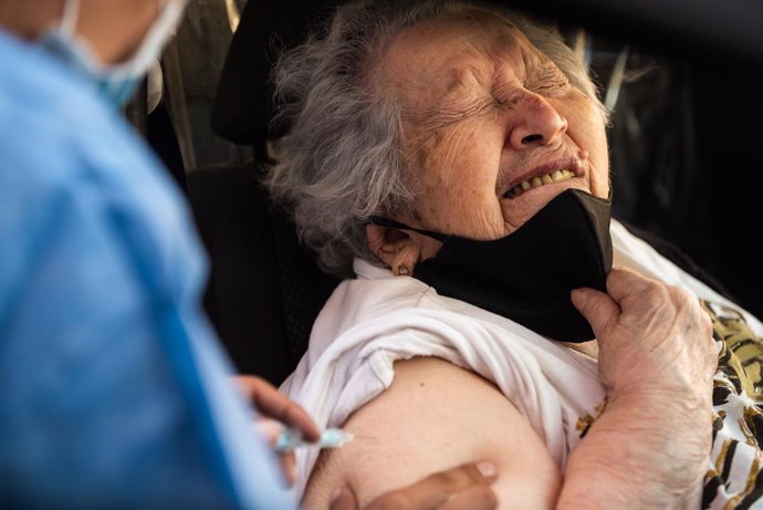 09 March 2021, Argentina, Buenos Aires: An elderly women reacts while receiving  her dose of a coronavirus vaccine inside her car. Photo: Alejo Manuel Avila/Le Pictorium Agency via ZUMA/dpa