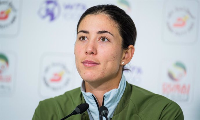 Garbine Muguruza of Spain talks to the media after the quarter-final at the 2021 Dubai Duty Free Tennis Championships WTA 1000 tournament