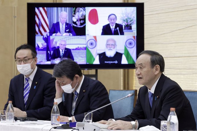 13 March 2021, Japan, Tokyo: Prime Minister of Japan Yoshihide Suga (R)takes part in a virtual meeting with Prime Minister of India Narendra Modi, President of the United States Joe Biden and Australian Prime Minister Scott Morrison as part of the inau