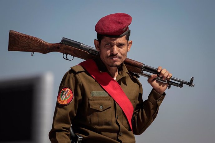 09 March 2021, Yemen, Sanaa: A military policeman attends a funeral procession held for members of the Houthi rebel movement who were allegedly killed in recent fighting with the Yemeni Saudi-backed government forces. Photo: Hani Al-Ansi/dpa
