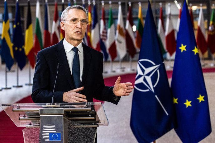 HANDOUT - 26 February 2021, Belgium, Brussels: The North Atlantic Treaty Organization (NATO) Secretary General Jens Stoltenberg speaks during a joint press conference with the European Council President Charles Michel (R) ahead of a video conference wit