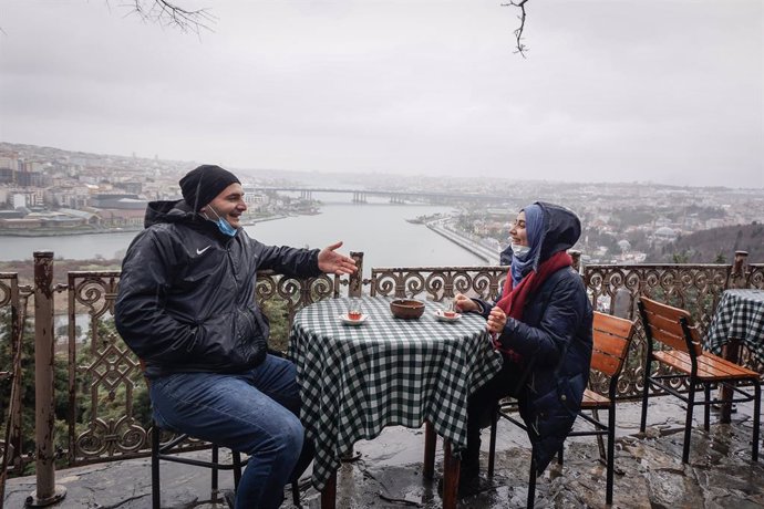 02 March 2021, Turkey, Istanbul: A couple sits at a reopened cafe. Turkish restaurants reopened and many children returned to school on Tuesday after the government announced steps to ease COVID-19 lockdown measures. Photo: Ibrahim Oner/SOPA Images via 