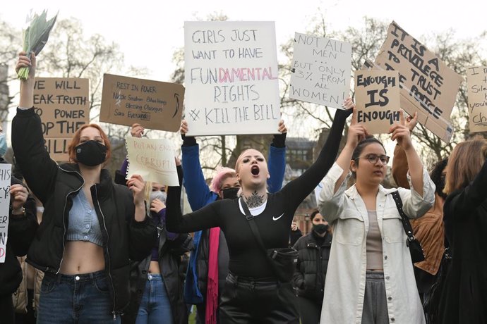15 March 2021, United Kingdom, London: Demonstrators hold placards during a Reclaim the Streets protest at the Parliament Square, in memory of Sarah Everard who went missing while walking home from a friend's flat on March 3. Photo: Dominic Lipinski/PA 