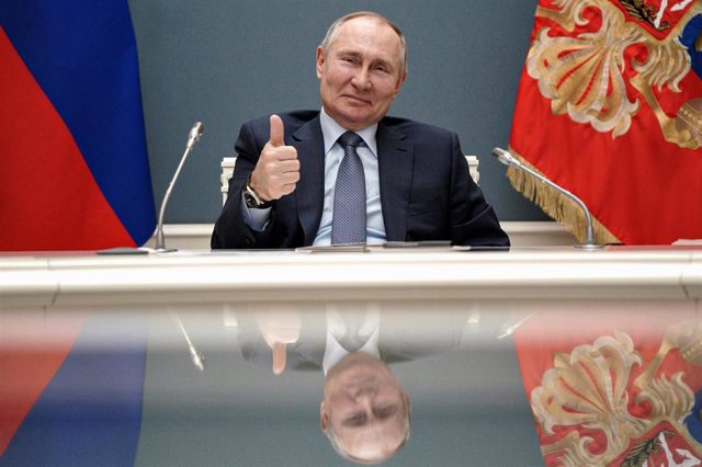 HANDOUT - 10 March 2021, Russia, Moscow: Russian President Vladimir Putin gestures during a via videoconference call with Turkish President Recep Tayyip Erdogan, during which they remotely inaugurate the construction of a third nuclear reactor of the Akku
