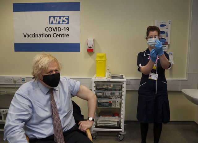 19 March 2021, United Kingdom, London: British Prime Minister Boris Johnson prepares to receive the first dose of AstraZeneca vaccine against Covid-19, at Westminster Bridge Vaccination Centre in St Thomas' Hospital. Photo: Frank Augstein/PA Wire/dpa