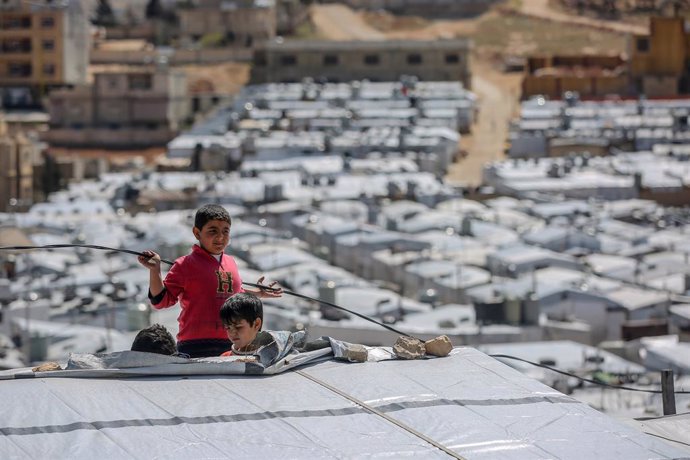 13 March 2021, Lebanon, Aarsal: Syrian refugee boys play at the Barra refugee camp in the Lebanese town of Aarsal, located north-east of capital Beirut. UNICEF said that after 10 years since the start of the Syrian conflict, war has left the lives and f