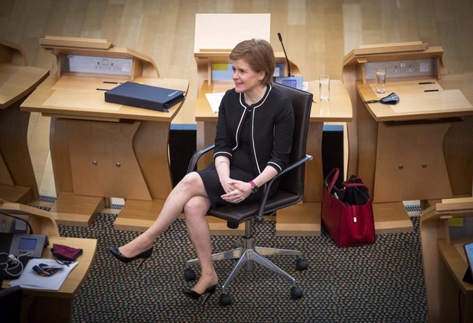23 March 2021, United Kingdom, Edinburgh: Scottish First Minister Nicola Sturgeon sists at the main chamber ahead of a COVID-19 briefing at the Scottish Parliament in Holyrood. Photo: Jane Barlow/PA Wire/dpa