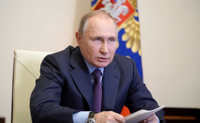 HANDOUT - 22 March 2021, Russia, Moscow: Russian President Vladimir Putin speaks during a videoconference meeting on increasing vaccine production and the course of vaccination against Coronavirus (Covid-19) in Russia. Photo: -/Kremlin/dpa - ATTENTION: 