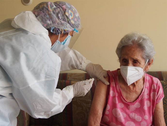 23 March 2021, Peru, Lima: An elderly woman receives her dose of a coronavirus vaccine as part of the Home Care Program for elderly. Photo: Carlos Garcia Granthon/ZUMA Wire/dpa