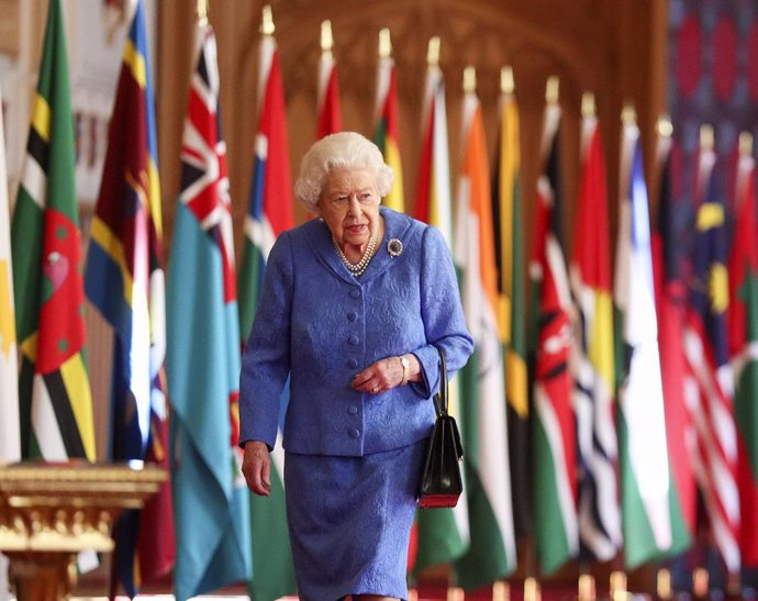 06 March 2021, United Kingdom, Windsor: Queen Elizabeth II walks past the flags of the Commonwealth member countries as part of Commonwealth Day at St George's Hall in Windsor Castle. Photo: Steve Parsons/PA Wire/dpa
