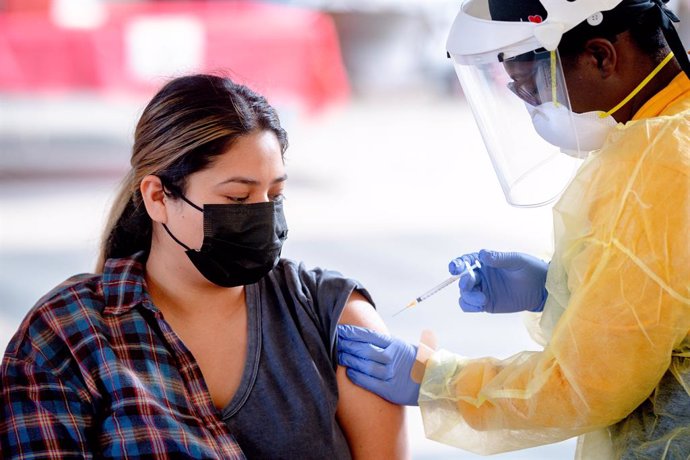 23 February 2021, US, Rancho Cucamonga: Carina Mares, 24, receives a shot of Pfizer/BioNTech COVID-19 vaccination at a new San Bernardino County vaccination super-site at the Inland Empire Health Plan headquarters. Photo: Watchara Phomicinda/Orange Coun