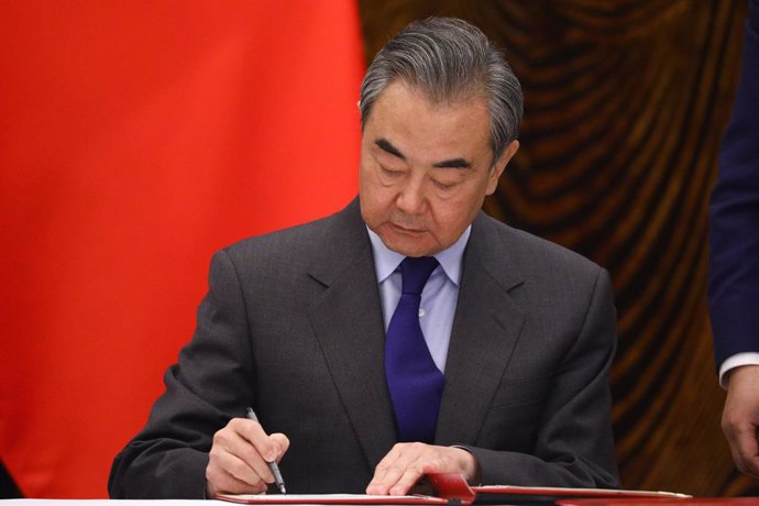 HANDOUT - 23 March 2021, China, Guilin: Chinese Foreign Minister Wang Yi signs a document during a signing ceremony with Russian Foreign Minister Sergey Lavrov (not pictured), after their meeting. Photo: -/Russian Foreign Ministry/dpa - ATTENTION: edito
