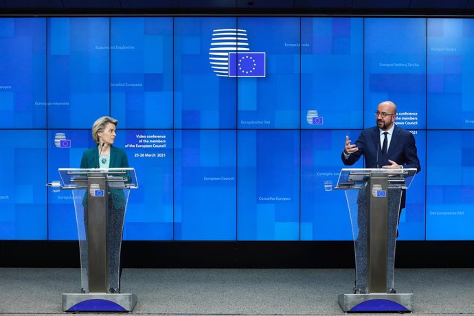 HANDOUT - 25 March 2021, Belgium, Brussels: European Council President Charles Michel (R) speaks during a press conferece with European Commission President Ursula von der Leyen after the online EU summit of heads of state and government at the European