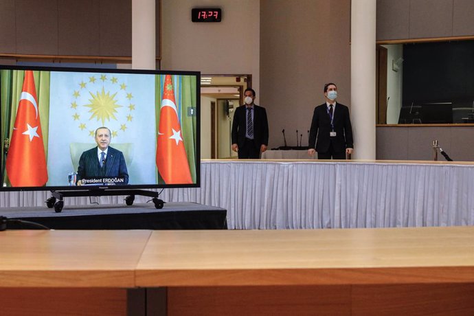 HANDOUT - 19 March 2021, Belgium, Brussels: Turkish President Recep Tayyip Erdogan (on screen) speaks during a video link meeting with European Commission President Ursula von der Leyen, and European Council President Charles Michel at the Europa Buildi