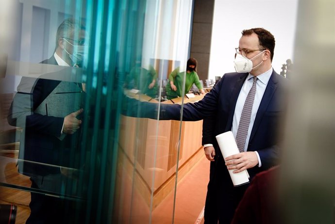 26 March 2021, Berlin: German Minister of Health Jens Spahn (R) and President of the Robert Koch Institute Lothar Wieler leave after attending a press conference on the Corona situation before Easter. Photo: Kay Nietfeld/dpa