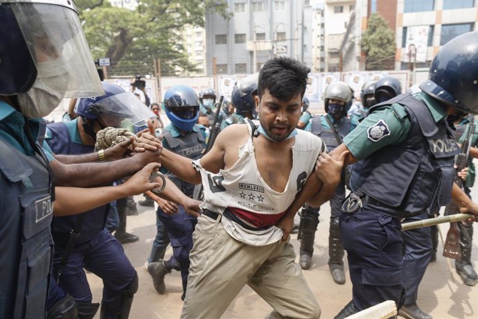 27 March 2021, Bangladesh, Dhaka: Bangladeshi police arrest a protester in front of the National Press Club during a protest against the visit of Indian Prime Minister Modi. Photo: Suvra Kanti Das/ZUMA Wire/dpa