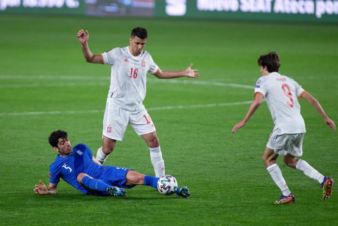 Andreas Bouchalakis of Greece and Rodrigo "Rodri" Hernandez of Spain during the FIFA World Cup 2022 Qatar qualifying match between Spain and Greece at Estadio Nuevo Los Carmenes on March 25, 2021 in Granada, Spain.