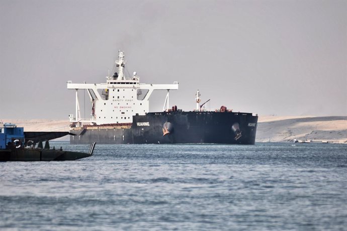 30 March 2021, Egypt, Ismailia: A ship sails through the Suez Canal as traffic resumes after the "Ever Given" container ship operated by the Evergreen Marine Corporation, was freed after blocking the waterway route for almost a week. Photo: Sayed Hassan