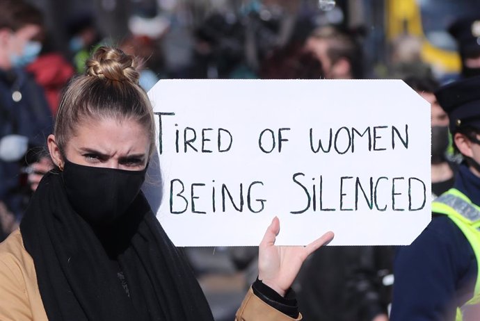 16 March 2021, Ireland, Dublin: A protester holds a sign during a protest organised in remembrance of murdered Sarah Everard and in protest of continued violence against women. Photo: Niall Carson/PA Wire/dpa