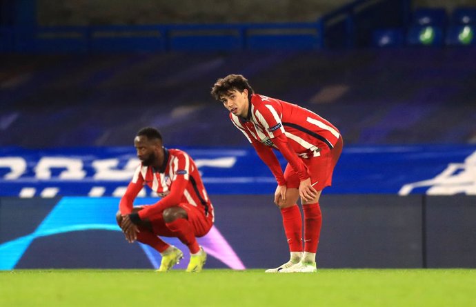 17 March 2021, United Kingdom, London: Atletico Madrid's Sequeira Joao Felix (R) and Thomas Lemar appear dejected after the UEFAChampions League round of 16 second leg match between Chelsea and Atletico Madrid at Stamford Bridge. Photo: Adam Davy/PA Wi