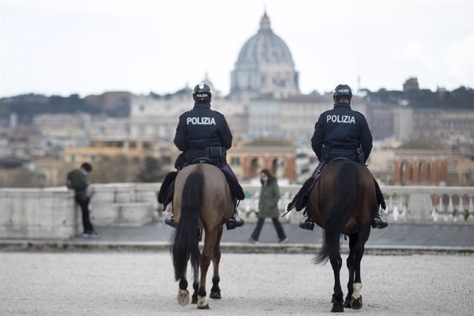 16 March 2021, Italy, Rome: Two policemen of the equestrian squad ride through the park of the Villa Borghese. Photo: Roberto Monaldo/LaPresse via ZUMA Press/dpa