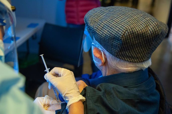 09 March 2021, Colombia, Bogota: An elderly man receives his dose of the Chinese COVID-19 Vaccine Sinovac at a vaccination centre. Photo: Chepa Beltran/VW Pics via ZUMA Wire/dpa