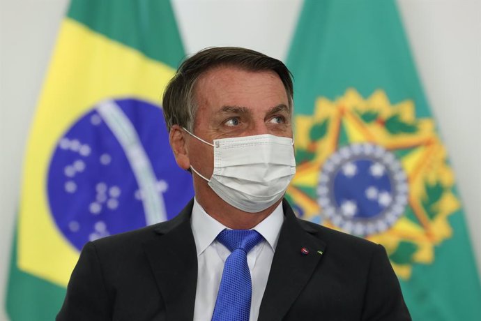 HANDOUT - 06 April 2021, Brazil, Brasilia: Brazilian President Jair Bolsonaro attends the appointment ceremony of the new ministers as part of an extensive cabinet reshuffle. Photo: Marcos Correa/Palacio Planalto/dpa - ATTENTION: editorial use only and 