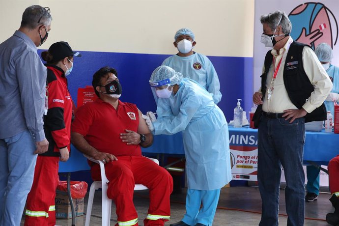 03 April 2021, Peru, Lima: Peruvian President Francisco Sagasti (R) is seen during the first day of vaccination against coronavirus for firefighters. Photo: Cesar Lanfranco/dpa