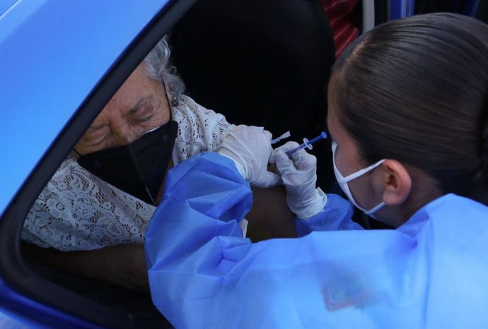 15 March 2021, Mexico, Tonala: A woman receives a dose of the coronavirus vaccine at a vaccination centre in the University Center of Tonala - University of Guadalajara. Photo: -/El Universal via ZUMA Wire/dpa