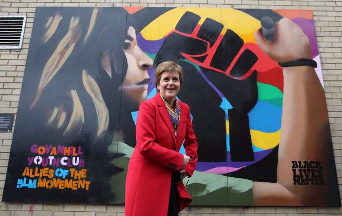08 April 2021, United Kingdom, Glasgow: First Minister of Scotland and leader of the Scottish National Party (SNP) Nicola Sturgeon poses next to a Black Lives Matters mural in Glasgow as she campaigns for the Scottish Parliamentary election. Photo: Andr