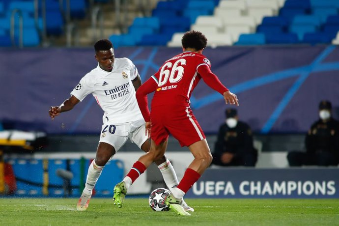 Vinicius Junior of Real Madrid and Trent Alexander-Arnold of Liverpool in action during the UEFA Champions League, Quarter finals round 1, football match played between Real Madrid and Liverpool FC at Alfredo Di Stefano stadium on April 06, 2021 in Vald