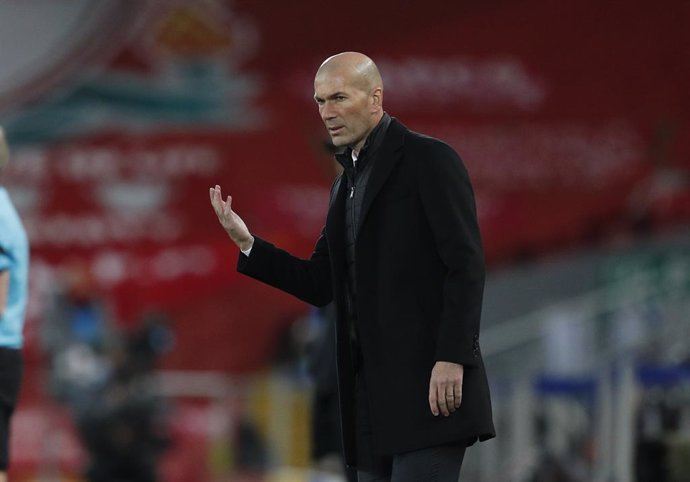 14 April 2021, United Kingdom, Liverpool: Real Madrid manager Zinedine Zidane stands on the sidelines during the UEFA Champions League quarter-finals, second-leg soccer match between Liverpool and Real Madrid at the Anfield. Photo: Darren Staples/CSM vi
