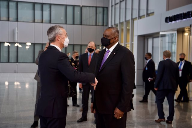 HANDOUT - 14 April 2021, Belgium, Brussels: NATO Secretary General Jens Stoltenberg (L) and US Secretary of Defense Lloyd Austin elbow bump prior to their meeting at NATO headquarters. Photo: -/NATO/dpa - ATTENTION: editorial use only and only if the cr