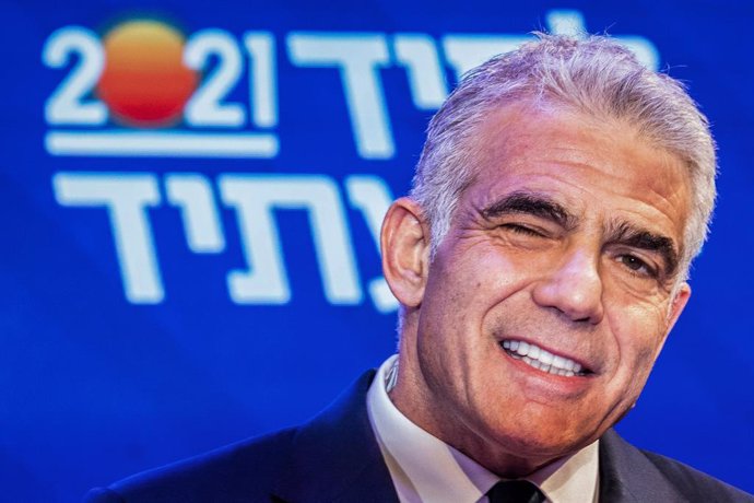 24 March 2021, Israel, Tel Aviv: Leader of the Yesh Atid opposition centrist political party Yair Lapid winks with his eye close as he addresses his supporters at his campaign headquarters, after polls closed in the Israeli Parliamentary election. (RECR