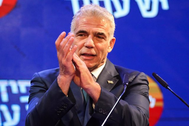 23 March 2021, Israel, Tel Aviv: Leader of the Yesh Atid opposition centrist political party Yair Lapid reacts during a press conference to address his supporters at his campaign headquarters after the early exit polls of the Israeli Parliamentary elect