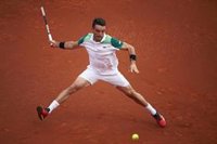 Bautista avanza en el adiós de la perla Alcaraz en Barcelona