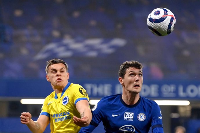 20 April 2021, United Kingdom, London: Brighton's Leandro Trossard (L) and Chelsea's Andreas Christensen battle for the ball during the English Premier League soccer match between Chelsea and Brighton & Hove Albion at Stamford Bridge. Photo: Mike Hewitt