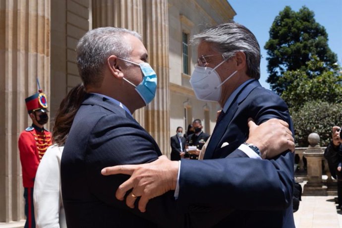 20 April 2021, Colombia, Bogota: Guillermo Lasso (R), president-elect of Ecuador, is received by Ivan Duque, president of Colombia, at the presidential palace. Lasso will assume the presidency of Ecuador on 24 May. Photo: ---/colprensa/dpa - ATENCIÓN: S