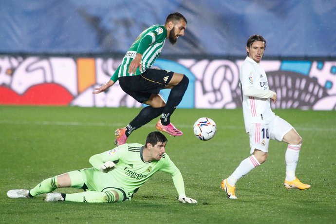 Borja Iglesias of Real Betis and Thibaut Courtois of Real Madrid in action during the spanish league, La Liga, football match played between Real Madrid and Real Betis at Ciudad Deportiva Real Madrid on April 24, 2021, in Valdebebas, Madrid, Spain.