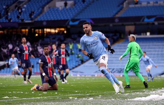 04 May 2021, United Kingdom, Manchester: Manchester City's Riyad Mahrez celebrates scoring his side's first goal during the UEFA Champions League Semi-Final second leg soccer match between Manchester City and Paris Saint-Germain at the Etihad Stadium. P