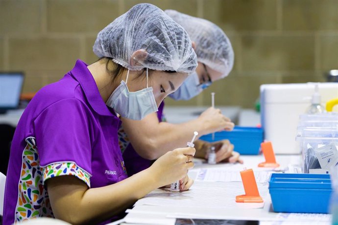 Nurses fill syringes with the COVID-19 AstraZeneca vaccine at the Claremont Showground mass vaccination centre in Perth, Monday, May 2, 2021. From today over-50s are eligible for the Covid-19 immunisation program at two mass public vaccination clinics i